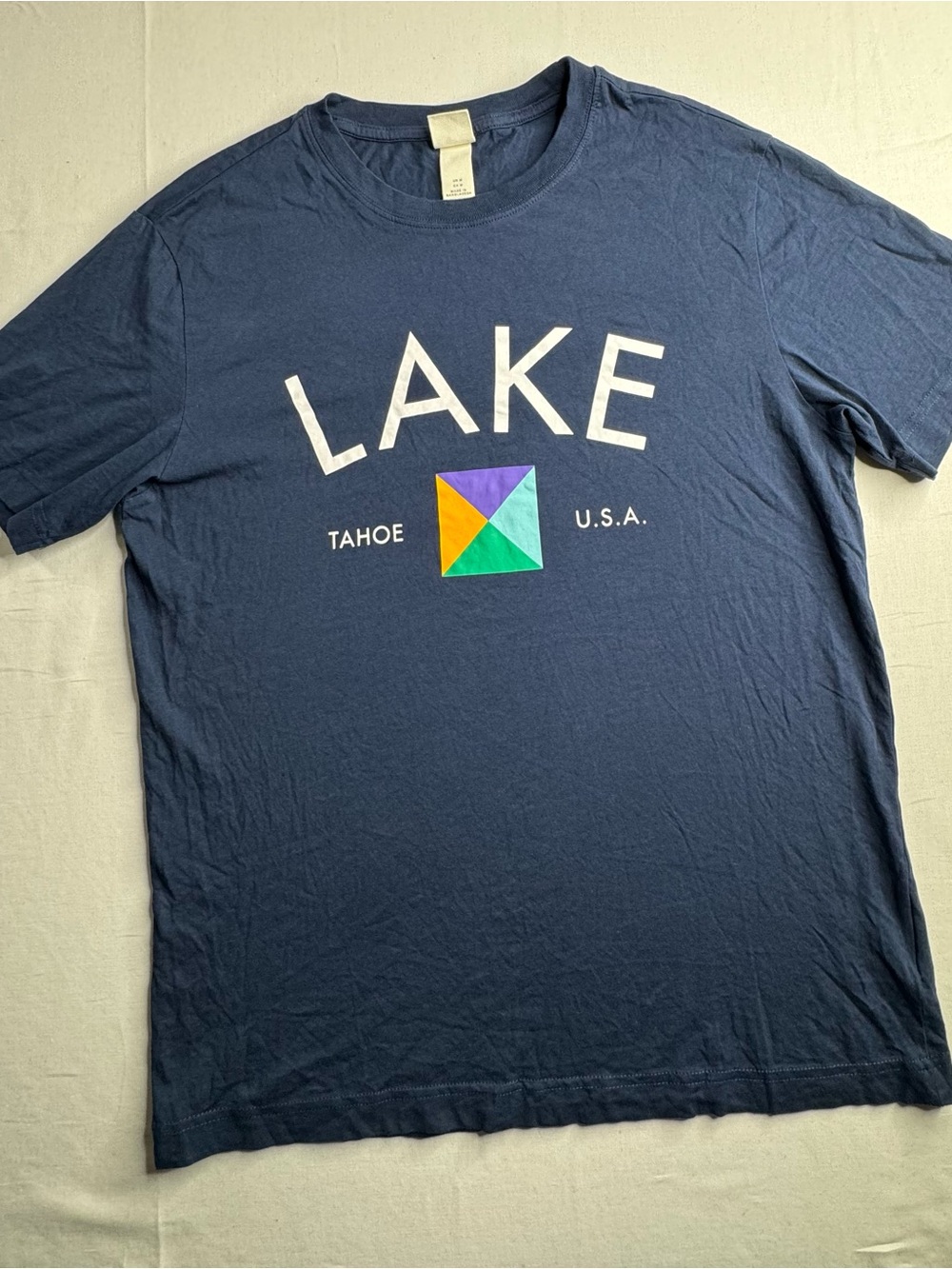 H&M Navy Short-Sleeve Graphic Tee with Multicolor Emblem